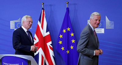 UK Secretary of State for Exiting the European Union David Davis (L) is welcomed by the European Commission's Chief Brexit Negotiator Michel Barnier at the start of Brexit talks in Brussels, Belgium