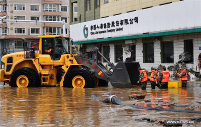 Rescuers expel water in Yongji County, northeast China's Jilin Province. Heavy rain caused waterlogging in Yongji