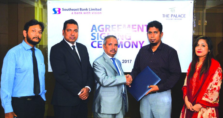 Md. Abdus Sabur Khan, Head of Cards of Southeast Bank Limited and Md. Hasnat Sudruddin Roomi, Chief Financial Officer of Palace Luxury Resort, exchanging an agreement signing documents in the city recently. Under the deal, bank's Credit and Debit Cardhol