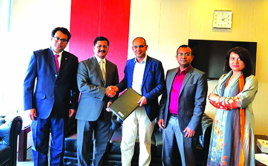 Md Mehmood Husain, Managing Director of NRB Bank Limited and Kaysar Ahmed, CEO of Milltech Solutions, exchanging a MoU documents at the bank's head office in the city on Monday. Imran Ahmed, FCA, Chief Operating Officer of the bank and Ahmed Saif Reza, C