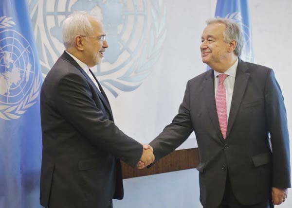 United Nations Secretary-General Antonio Guterres, (right) and Iran's Foreign Minister Javad Zarif shake hands before their meeting on Monday.