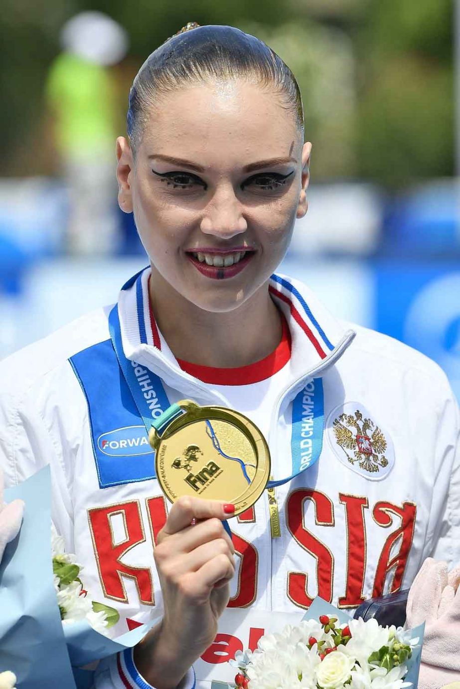 Gold medal winner Svetlana Kolesnichenko of Russia poses with her medal during the awarding ceremony of the women's synchronized swimming solo free final free routine of FINA Swimming World Championships 2017 in the City Park in Budapest, Hungary on Wedn