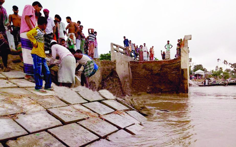 This is for the seventh time that under-construction river bank protection embankment at Chauhali upazila in Sirajganj district collapsed again creating fresh panic among the locals though the people struggling hard to protect it. This photo was taken fro