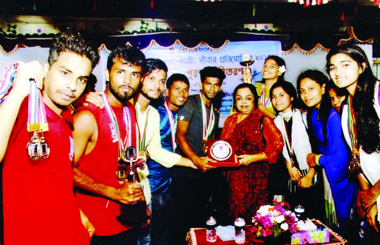 The winners of the 44th Inter-Hall Students (Male & Female) Swimming Competition of Dhaka University (DU) with the chief guest Pro-Vice Chancellor (Academic) Professor Dr Nasreen Ahmed pose for a photo session in front of the swimming pool of DU on Thursd