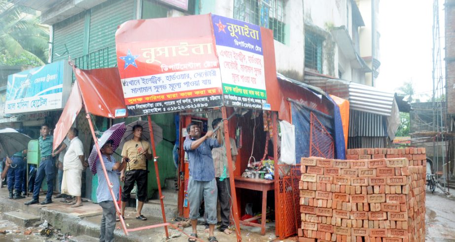 Drive against illegal construction by CCC Mobile Court is going on at Sirajuddowlah Road in Chakbazar Thana area on Wednesday.