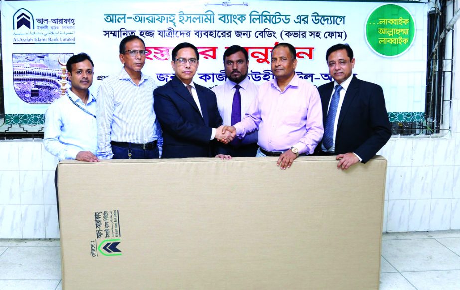 Al-Arafah Islami Bank Limited has donated 250 beddings (cover with foam) for the pilgrims during their stay at hajji camp. Kazi Towhidul Alam, DMD of the bank handing over beddings to Md. Saiful Alam, Director (Hajj), Ministry of Religious Affairs at Ash