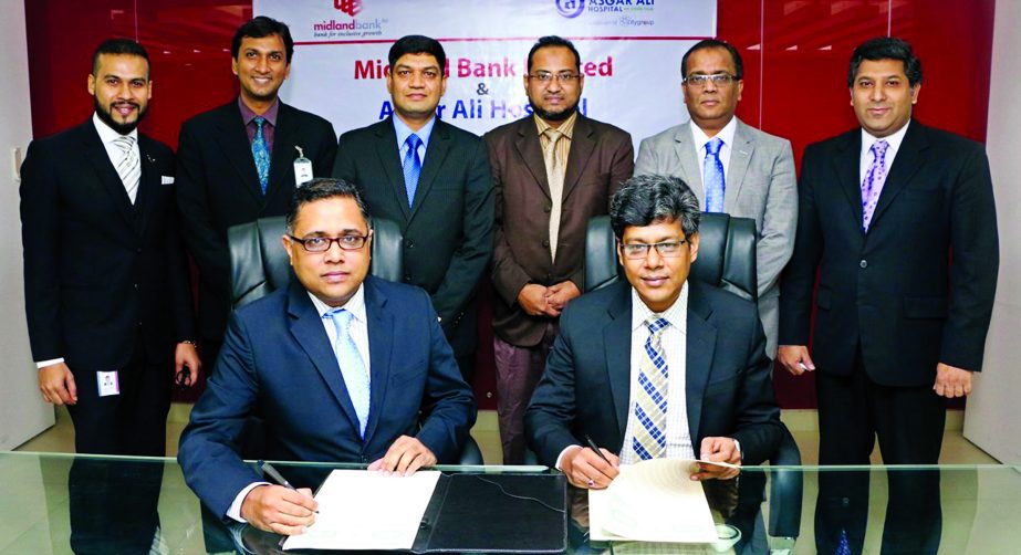 Md Ridwanul Hoque, SVP and Head of Retail Distribution of Midland Bank Limited and Kabir Uddin Tusher, GM, Marketing and Business Development of Asgar Ali Hospital, sign an agreement at the Bank's head office on Thursday. Under this deal, the bank's VIS