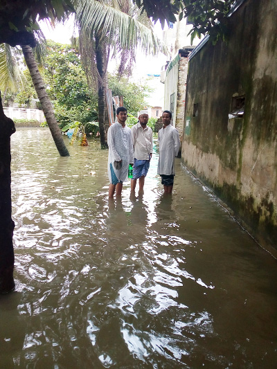 Low-lying areas of West Bakalia in the Port city have been inundated with rain water accompanied with high sea tide flow .The picture was taken at 2 pm on Friday.