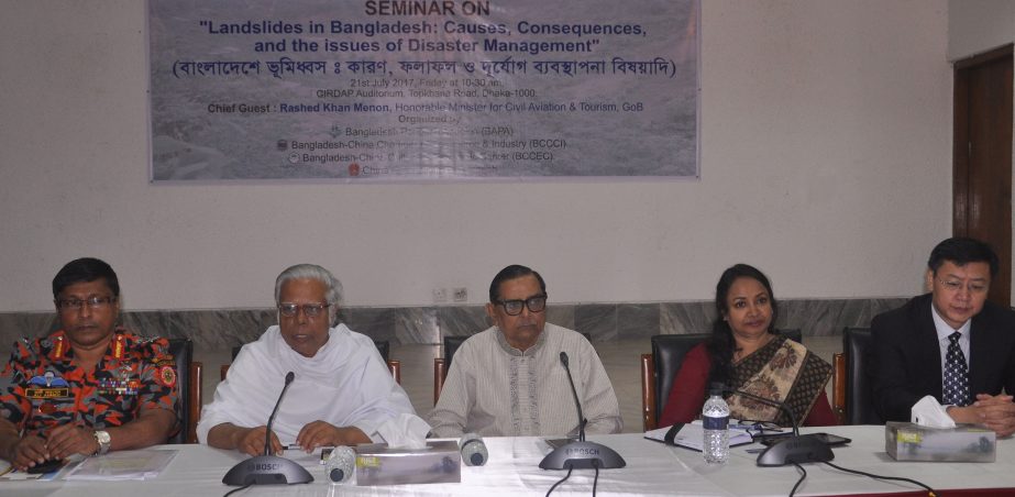 Civil Aviation and Tourism Minister Rashed Khan Menon, among others, at a seminar on 'Landslide in Bangladesh: Causes and Effect' organised by different organisations including Save The Environment Movement at CIRDAP auditorium in the city on Friday.