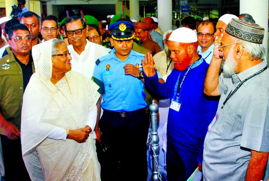 Prime Minister Sheikh Hasina exchanging pleasantries with Hajj pilgrims at the inauguration of Hajj activities at Ashkona Hajj Camp in the city on Saturday. BSS photo
