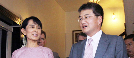 Myanmar's pro-democracy leader Aung San Suu Kyi, left, stands along with Joseph Y. Yun, right, US deputy assistant secretary of state for East Asian and Pacific Affairs.