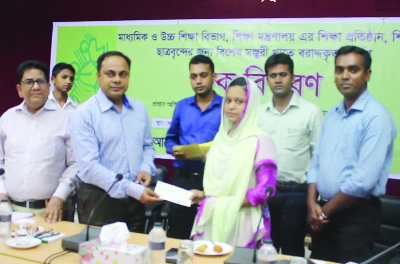 PATUAKHALI: Dr Md Masumur Rahman, DC, Patuakhali distributing allocated money to the meritorious students of schools, college and university at a function held recently.