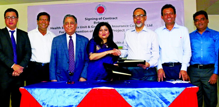 Md Ashadul Islam, Director General of Health Economics Unit of Health Ministry and Farzana Chowdhury, Managing Director and CEO of Green Delta Insurance, sign an agreement for the implementation of 2nd phase of Shasthyo Surokhsha Karmasuchi project at th