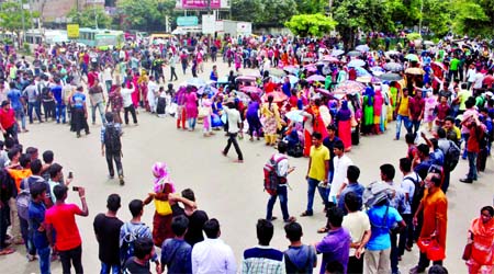 Seven DU affiliated college students blocked the road at Nilkhet corner near New Market protesting police assault on them including Siddiqur Rahman in city's Shahbagh area. This photo was taken on Saturday.