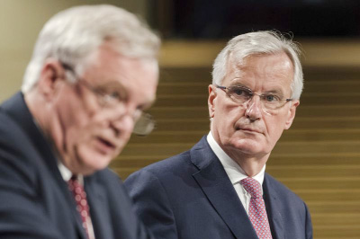 EU chief Brexit negotiator Michel Barnier, right, and British Secretary of State David Davis address the media after a week of negotiations at EU headquarters in Brussels.