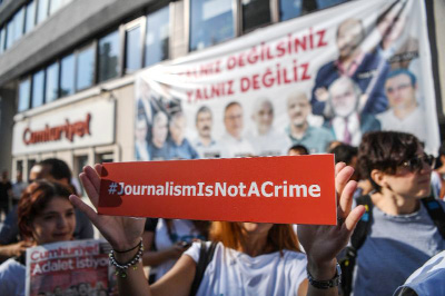 A total of 17 staff at one of Turkey's most respected opposition newspapers are in the dock