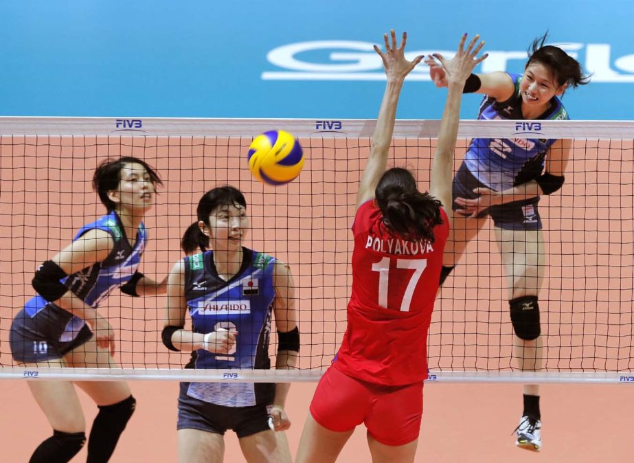 Japan's Sarina Koga (right) (2) spikes the ball during the match against Russia in the World Grand Prix volleyball women's championship in Hong Kong on Sunday.