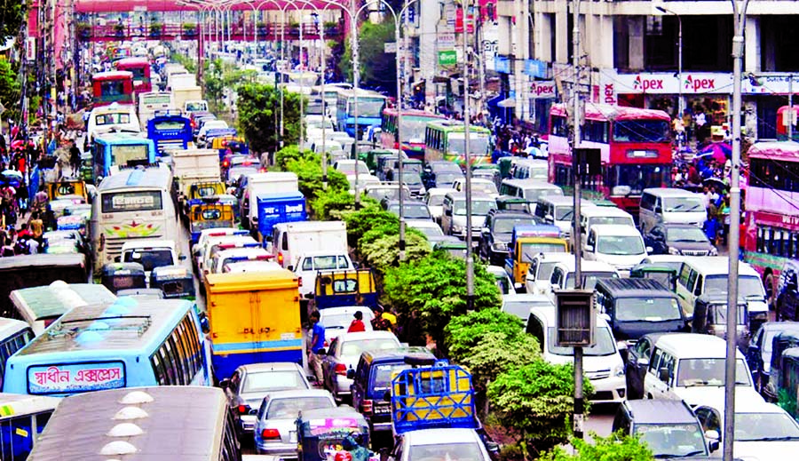 Thousands of vehicles remained stuck in traffic gridlock, causing sufferings to commuters for several hours. This photo was taken from Farmgate area on Monday.