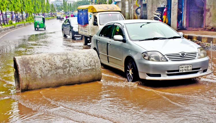 Motorised vehicles struggle through the pothole strewn road taking risk of accidents. Besides, a pipe set up middle of the road adds woes of the passengers and also pedestrians. But the authorities concerned seemed to be blind to repair the road to mitiga