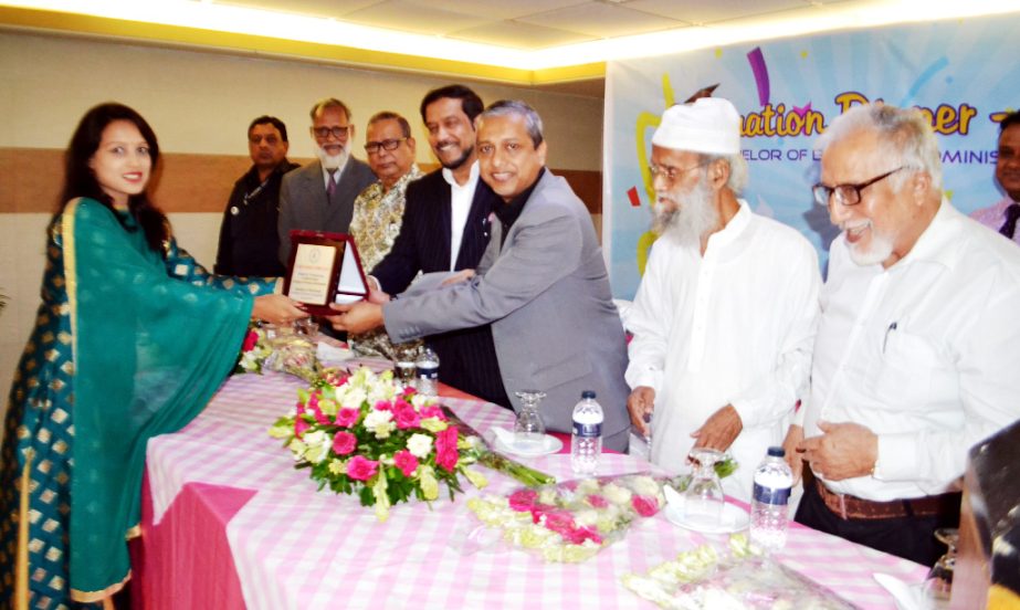 Prof Dr AYM Abdullah, Chairman of Northern University Bangladesh Trust handing over the Dean's Award and Dean's List Awards to the recipients at a Graduation Dinner program on the occasion of the BBA (Honors) degree completion of the students of the NUB