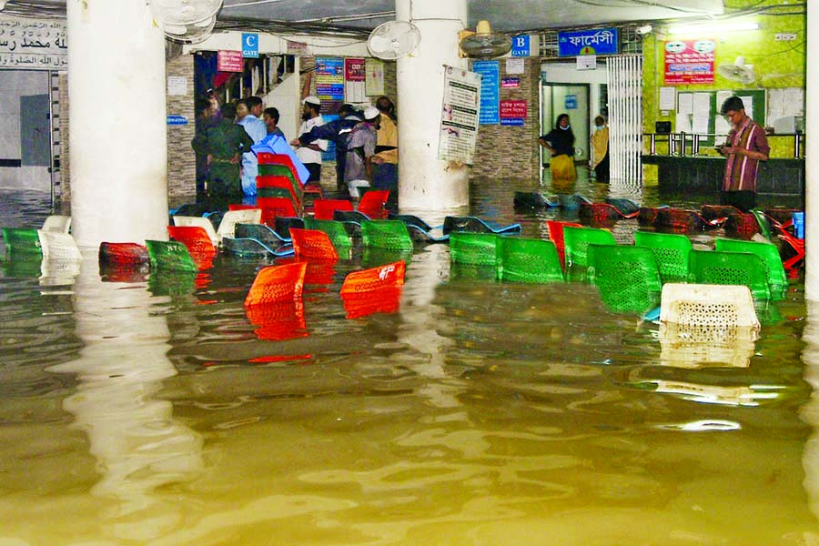 Patients facing immense trouble at the Shishu Hospital in Ctgâ€™s Agrabad area as its ground floor went under knee-deep water due to incessant rains in the last three days. This photo was taken on Tuesday.