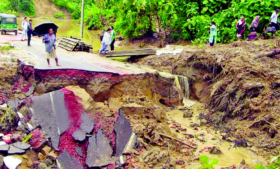 The road link between Rangamati-Khagrachhari has been snapped due to 25 metre road collapsed following heavy rains and landslides in the last three days, causing obstacles to movement of vehicles. This photo was taken from Khagrachhari on Tuesday.