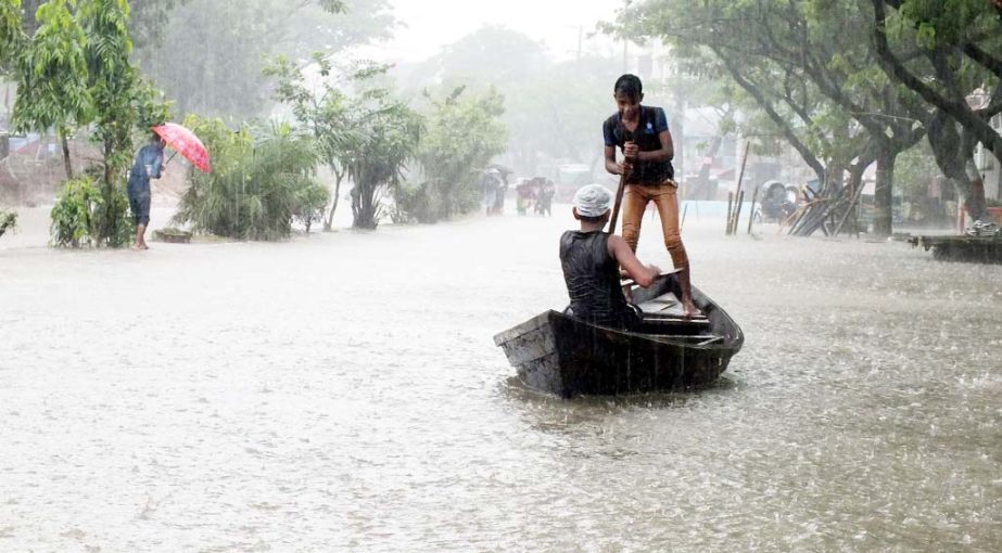 People at Agrabad area are using boat as transport due to heavy rainfall on Tuesday.