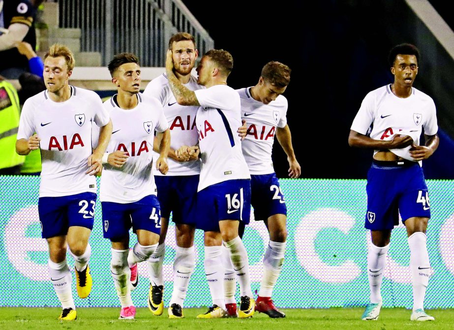 Tottenham players celebrate a goal by Vincent Janssen (third from left) against AS Roma during the second half of an International Champions Cup soccer game in Harrison, N.J. on Tuesday. AS Roma won 3-2.