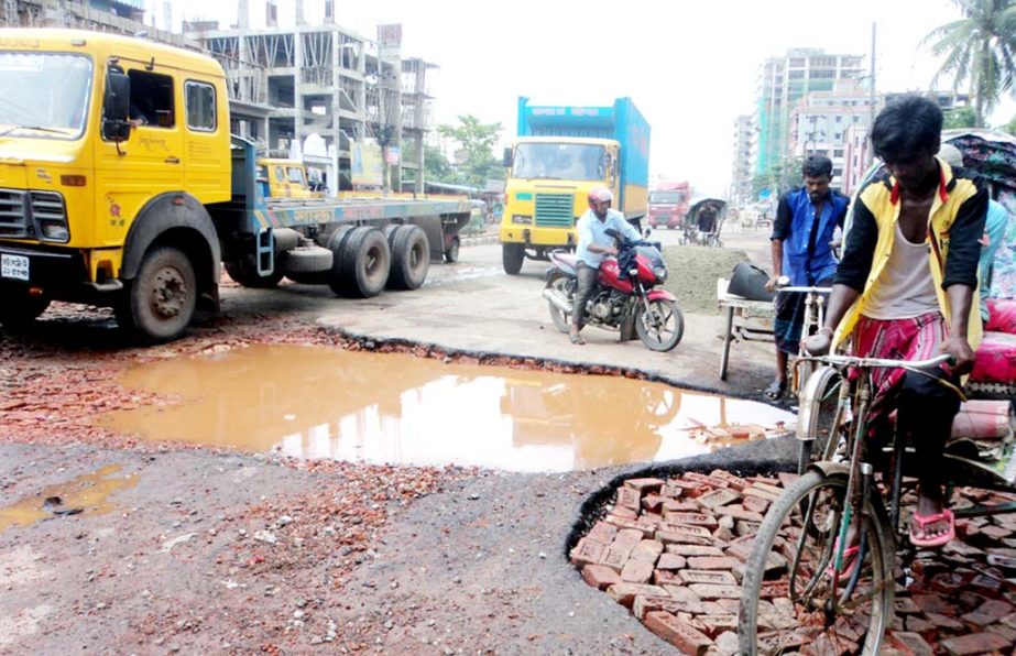 Dilapidated Nimtoli- Alankar Road in Chittagong City has been badly damaged due to continuous rainfall for two days which needs immediate repair. This snap was taken yesterday.