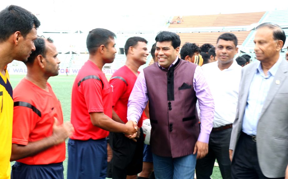 Operative Director (Head of Sports & Welfare Department) of Walton Group FM Iqbal Bin Anwar Dawn being introduced with the players of the participating teams of the Walton 1st Dhaka Metropolis Football Tournament as the chief guest at the Bir Shreshtha Sh