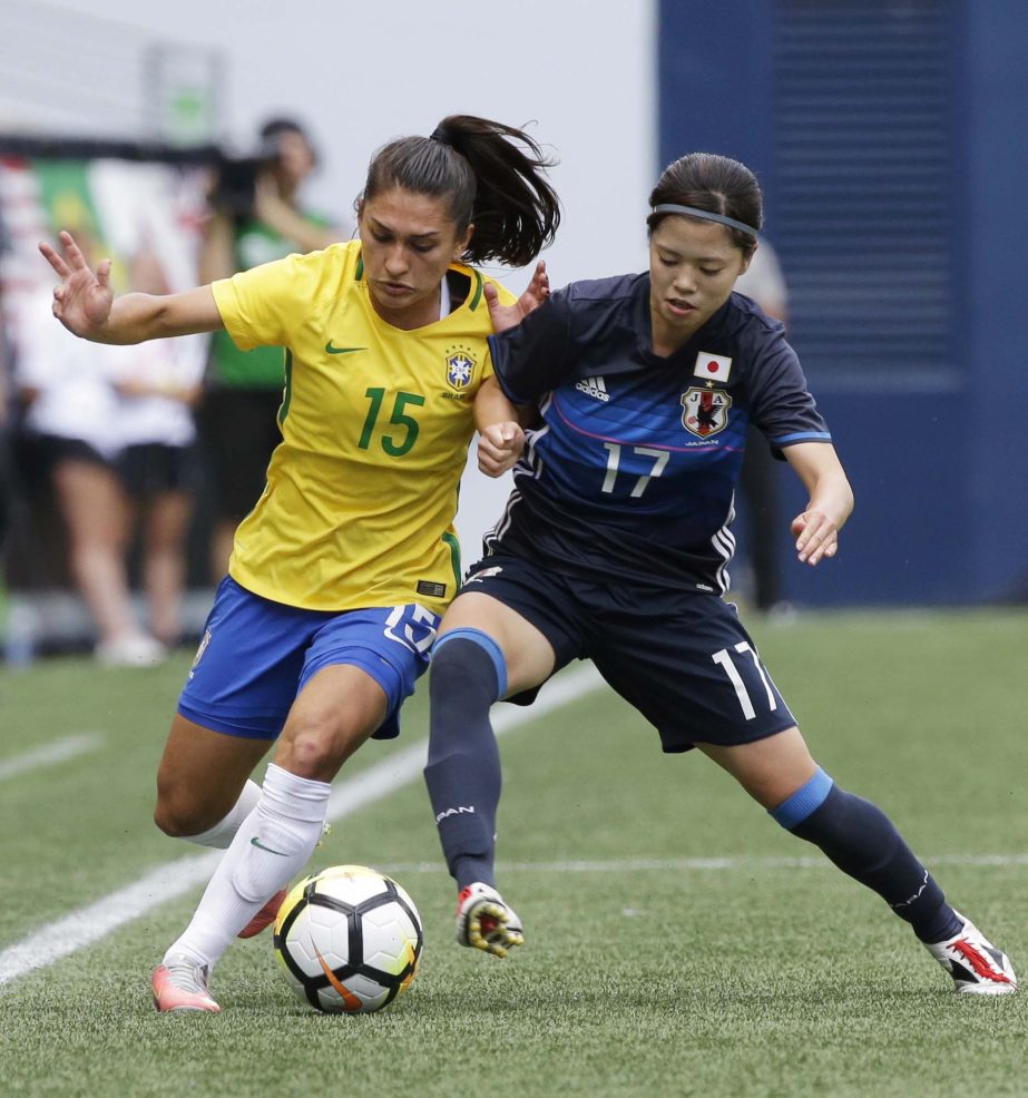 Japan midfielder Yui Hasegawa (17) pressures Brazil defender Leticia (15) during the first half of a Tournament of Nations women's soccer match in Seattle on Thursday.