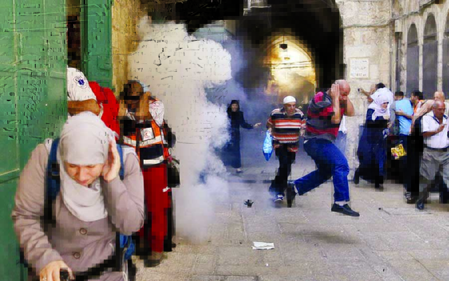 Palestinians react as a stun grenade explodes in a street at Jerusalem's Old city outside the compound known to Muslims as Noble Sanctuary and to Jews as Temple Mount, after Israel removed all security measures it had installed at the compound. Internet
