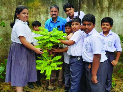 NARAYNAGNAJ: G M Faruk, Chairman, Governing body of Change School with the students planting saplings at the school compound in Narayanganj recently.