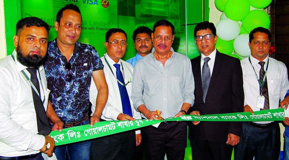 Md. Mahbubur Rahman Khan, Director of National Bank Limited, inaugurating an ATM booth at Goalchamat branch, Faridpur on Thursday. Md. Mahfuzur Rahman, Executive Vice President and Head of Card Division was also present.