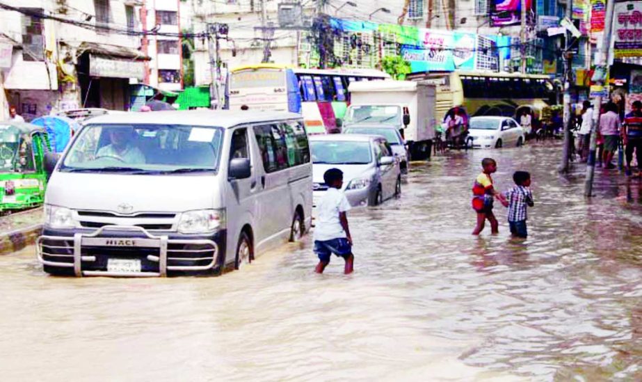 City's Malibagh Chowdhurypara to Rampura road is in dilapidated condition due to incessant rains and lack of proper drainage system, waters being logged, causing sufferings to commuters, and local residents. This photo was taken on Saturday.