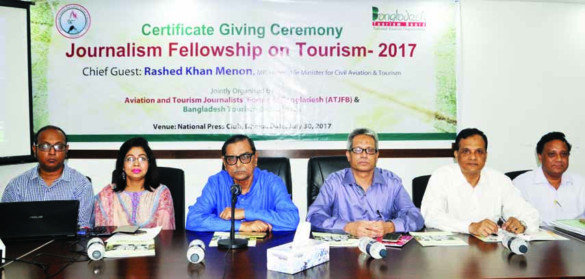 Civil Aviation and Tourism Minister Rashed Khan Menon, among others, at the certificate giving ceremony on 'Journalism Fellowship on Tourism-2017' organised by Bangladesh Tourism Board at the Jatiya Press Club on Sunday.