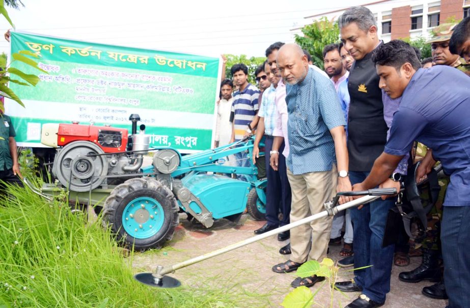 Prof Dr Nazmul Ahsan Kalimullah, BTFO, Vice Chancellor of Begum Rokeya University, Rangpur inaugurating two grass cutter machines (one is automated and another is manual) at the University's Academic Building -3 on Sunday.