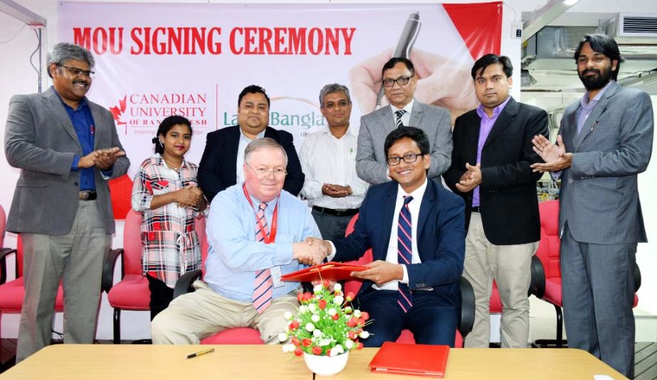 Prof William H Derrenger, Vice Chancellor, Canadian University of Bangladesh and Md. Shariful Islam Mridha, Head of Human Resources, LankaBangla Finance Ltd exchanging the MoU documents after signing it at the University Auditorium on Saturday.