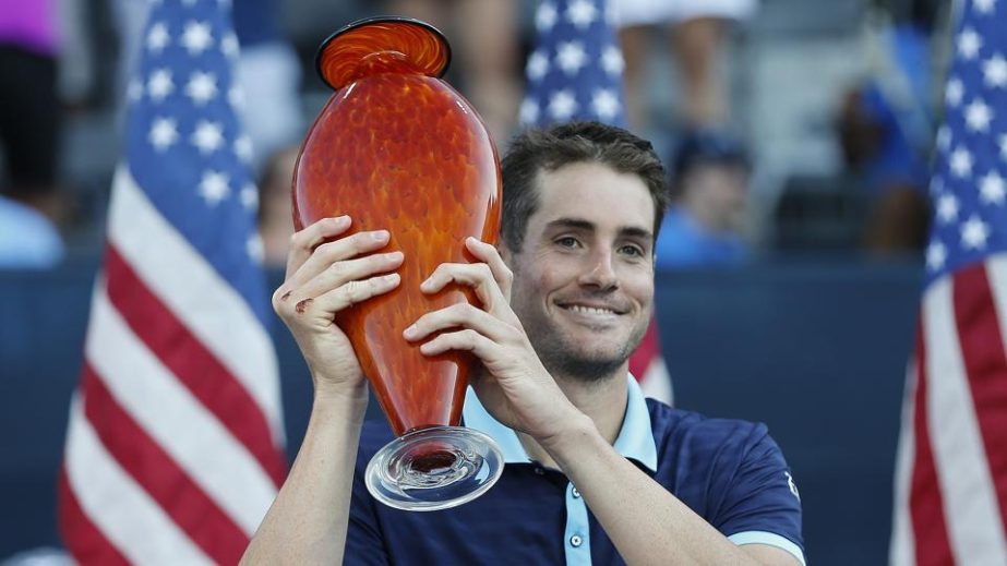 John Isner poses with the trophy after defeating Ryan Harrison in the finals of the ATP?Atlanta Open on Sunday.