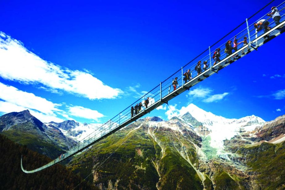 A nearly 500m bridge for hikers billed as the longest hanging pedestrian bridge in the world has opened near the Swiss town of Zermatt. The 494m bridge, named the EuropabrÃ¼cke (Europe Bridge), hangs up to 85m above the Grabengufer ravine.