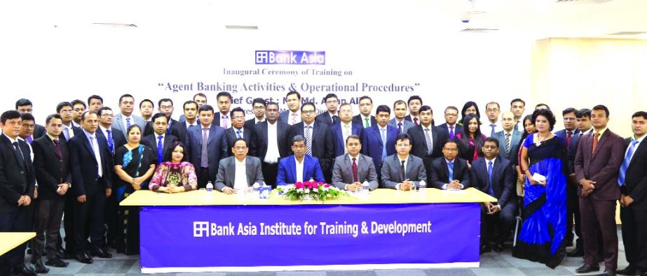 Md. Arfan Ali, Managing Director of Bank Asia Ltd, poses with the participants of a day-long training programme on "Agent Banking Activities and Operational Procedures" at its training and development institute in the city on Saturday. Top officials of