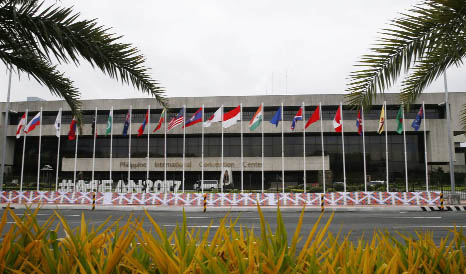 Flags flutter outside the Philippine International Convention Center, the venue for the Aug. 2-8 50th Association of Southeast Asian Nations Foreign Ministers' Meeting and its regional partners, on Wednesday in suburban Pasay city, south of Manila, Phili