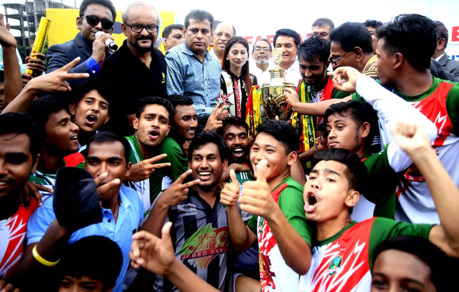 Members of Green University, the champions of the Walton 1st Inter-University Football Tournament with the guests pose for a photo session at the Bir Shreshtha Shaheed Sepoy Mohammad Mostafa Kamal Stadium in the city's Kamalapur on Thursday.