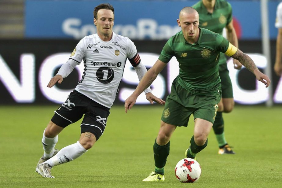 Celtic's Scott Brown (right) and Rosenborg's Mike Jensen battle for the ball during the Champions League, third qualifying round, 2nd leg soccer match between Rosenborg and Celtic at Lerkendal Stadium in Trondheim, Norway on Wednesday.