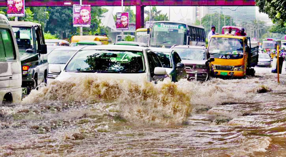 City experiences heavy downpour for about three hours at stretch made the situation worse. This photo was taken from Bangla Motor area on Thursday.