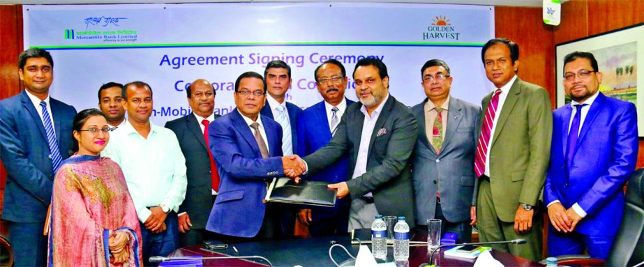 Kazi Masihur Rahman, Managing Director of Mercantile Bank Limited and Mohius Samad Choudhury, Director of Golden Harvest, sign an agreement for fund collection from countrywide distributors of Golden Harvest through 'MYCash' mobile banking platform of t