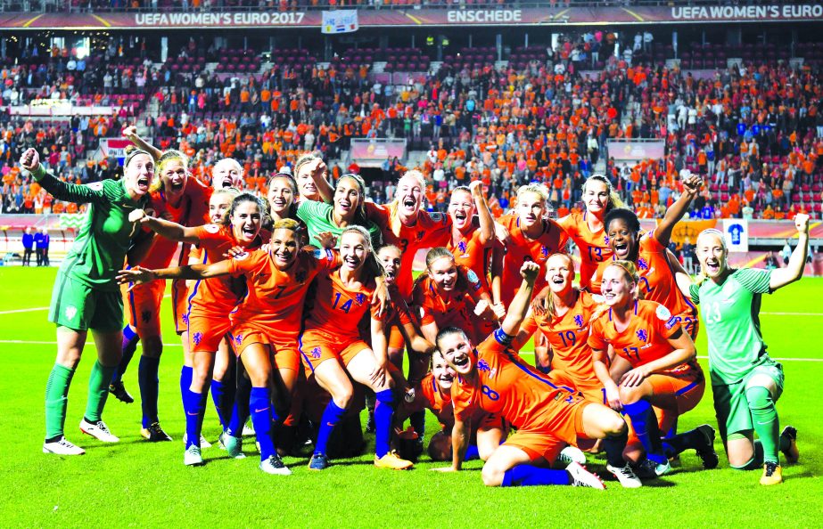 Netherlands players celebrate after the Women's Euro 2017 semifinal soccer match between the Netherlands and England in Enschede, the Netherlands on Thursday.