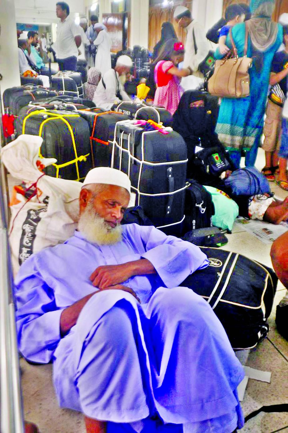 Biman cancels 19 Hajj flights till Friday due to visa complications of the would-be pilgrims those passing days in agony as they are awaiting visas at Ashkona camp. This photo was taken on Friday.