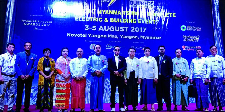 Faizul Alam, Managing Director of Savor International (Bd) Limited, poses with the participants at the inaugural ceremony of a three-days long International Exhibition on 'Builders Myanmar 2017', a construction and building material exhibition at Yang