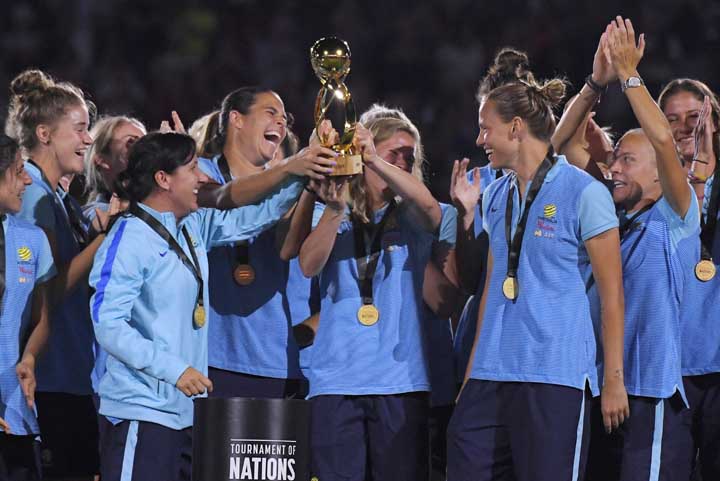 Members of the Australian team hold up their trophy after they defeating Brazil 6-1 in a Tournament of Nations soccer match in Carson, Calif on Thursday.